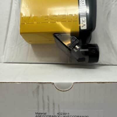 A yellow Kaeser Eco Drain 30 (P/N Anecodrain30) device sits on a white box labeled with product details, including "ECO DRAIN 30 (95-230VAC)" and "Made in Germany.