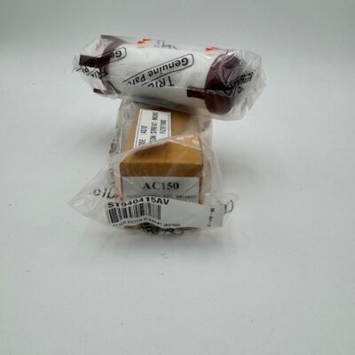 Two Powerex After Filter Elements (P/N ST940415AV, Trident P/N AS702) in clear plastic with labels are stacked atop a small brown cardboard box, also wrapped in plastic, all set against a plain white background.