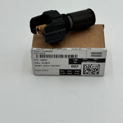 A black cylindrical Atlas Copco Auto Drain (P/N 1629 4035 00) with a textured grip rests on a small cardboard box labeled with a barcode, QR code, and product information.