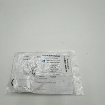 A sealed plastic bag with a folded instruction sheet labeled "Atlas Copco EWD 330, 330C Wearing Parts" (P/N 2901063300) dated 19/12/2023 is placed on a plain white surface.