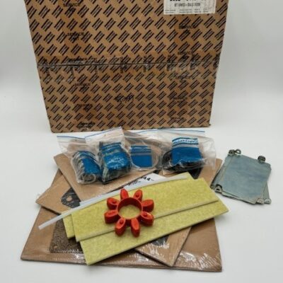 The Atlas Copco GV200 Vanes + Seals Kit (P/N 2902 0419 00) includes blue and red vanes, gaskets, and metal components, shown in front of a large cardboard box featuring a printed label and Atlas Copco logo pattern.