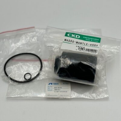 A Powerex, Inc. Oil Mist Catcher Kit (P/N 92514270) on a white surface. Its plastic bag is labeled "CKD M4000 MANTLE ASSY" and contains a black cylindrical part, a small O-ring, and a larger O-ring. Another label reads "OIL MIST CATCHER KIT.