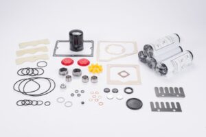 The Leybold Major Repair Kit SOGEVAC SV200 - BR1/BR2 (P/N 71436190) includes assorted mechanical parts like O-rings, gaskets, filters, bearings, washers, and metal plates, all neatly arranged on a white surface.